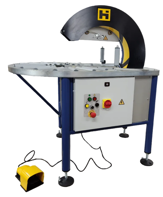Industrial machine with control panel and warning labels on a dark background