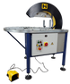 Industrial machine with control panel and warning labels on a dark background