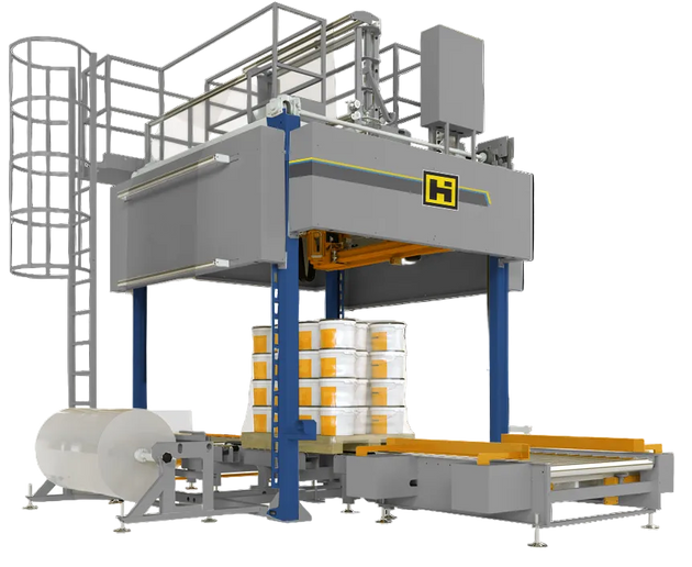 Industrial packaging machine with boxes on a conveyor belt against a black background