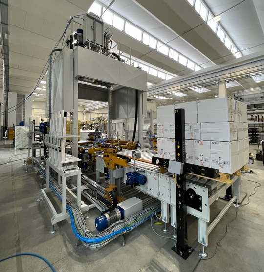 Factory automation system with boxes on a conveyor belt